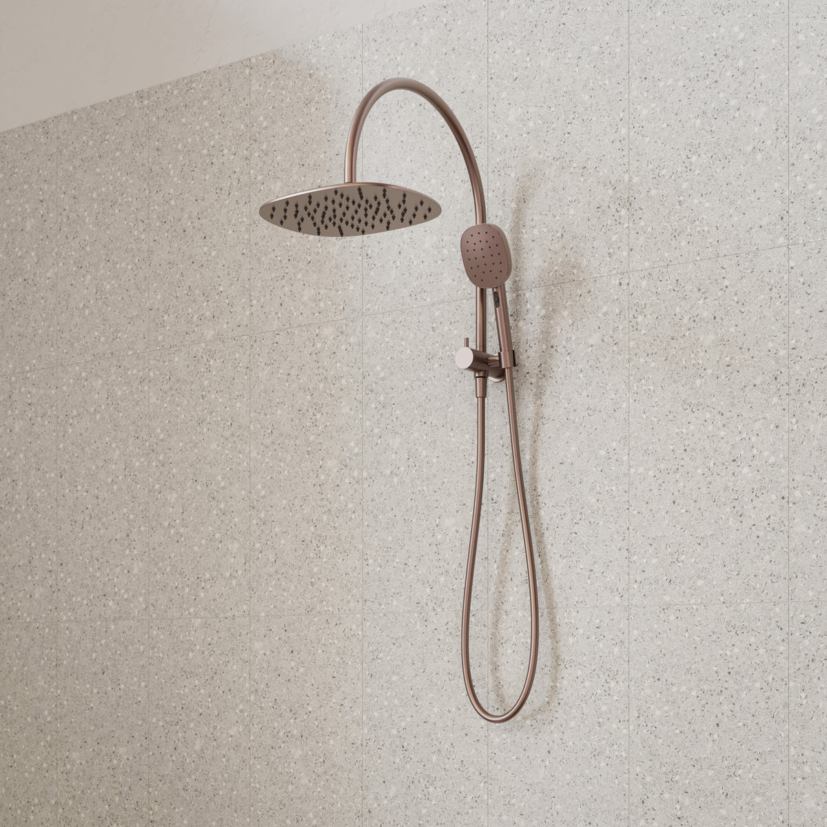 Caroma Contura II compact twin shower in brushed bronze, with round overhead rose and hand shower on rail