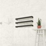 Thermogroup matte black single heated towel rail mounted on a tiled bathroom wall, shown with three stacked bars.