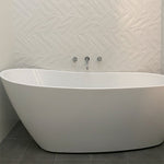 Clark round chrome swivel bath outlet above a freestanding white bath in a modern bathroom