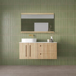 Marquis Gold wall hung vanity in natural oak with white above-counter basin and brushed gold tapware, front view