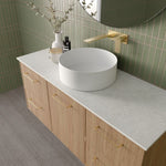 Marquis Hamilton wall hung vanity with oak woodgrain drawers, white solid surface top and round basin, angled view