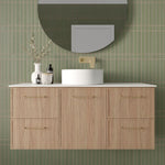 Marquis Hamilton wall hung vanity with white solid surface top, oak finish and centre bowl basin in bathroom setting
