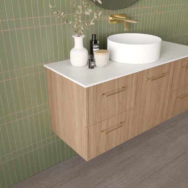 Marquis Hamilton wall hung vanity in oak woodgrain with white solid surface top, brass handles and round basin, angled view