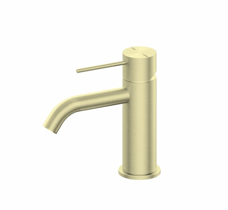 Nero Mecca basin mixer in brushed gold, single-lever bathroom tap with curved spout on white background