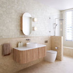 Ingrain curved fluted wall hung vanity in woodgrain with white top and round basin in a contemporary bathroom