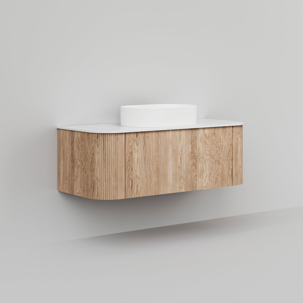Ingrain curved wall hung vanity in woodgrain with white top, shown front on against a plain wall