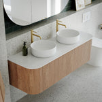 Ingrain curved fluted wall hung vanity with white top and double round basins in a modern bathroom setting