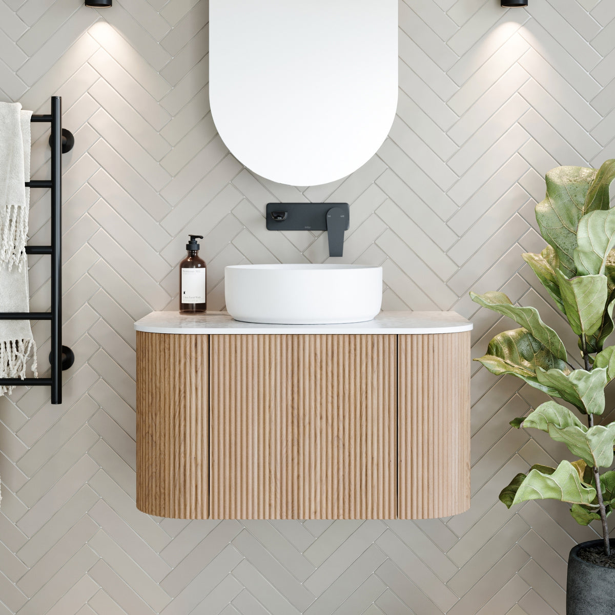 Ingrain curved fluted wall hung vanity with white top and oval basin in light woodgrain bathroom setting