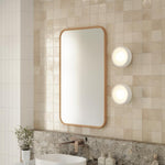 Ingrain rectangular timber framed mirror in ash finish, shown wall hung in portrait above a bathroom vanity