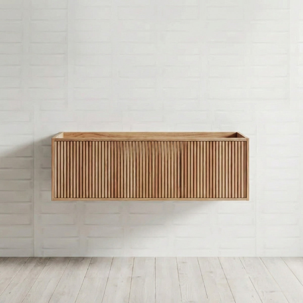 Ingrain Grooved wall-hung vanity in ash woodgrain with fluted drawer front, shown front on against a white tiled wall.