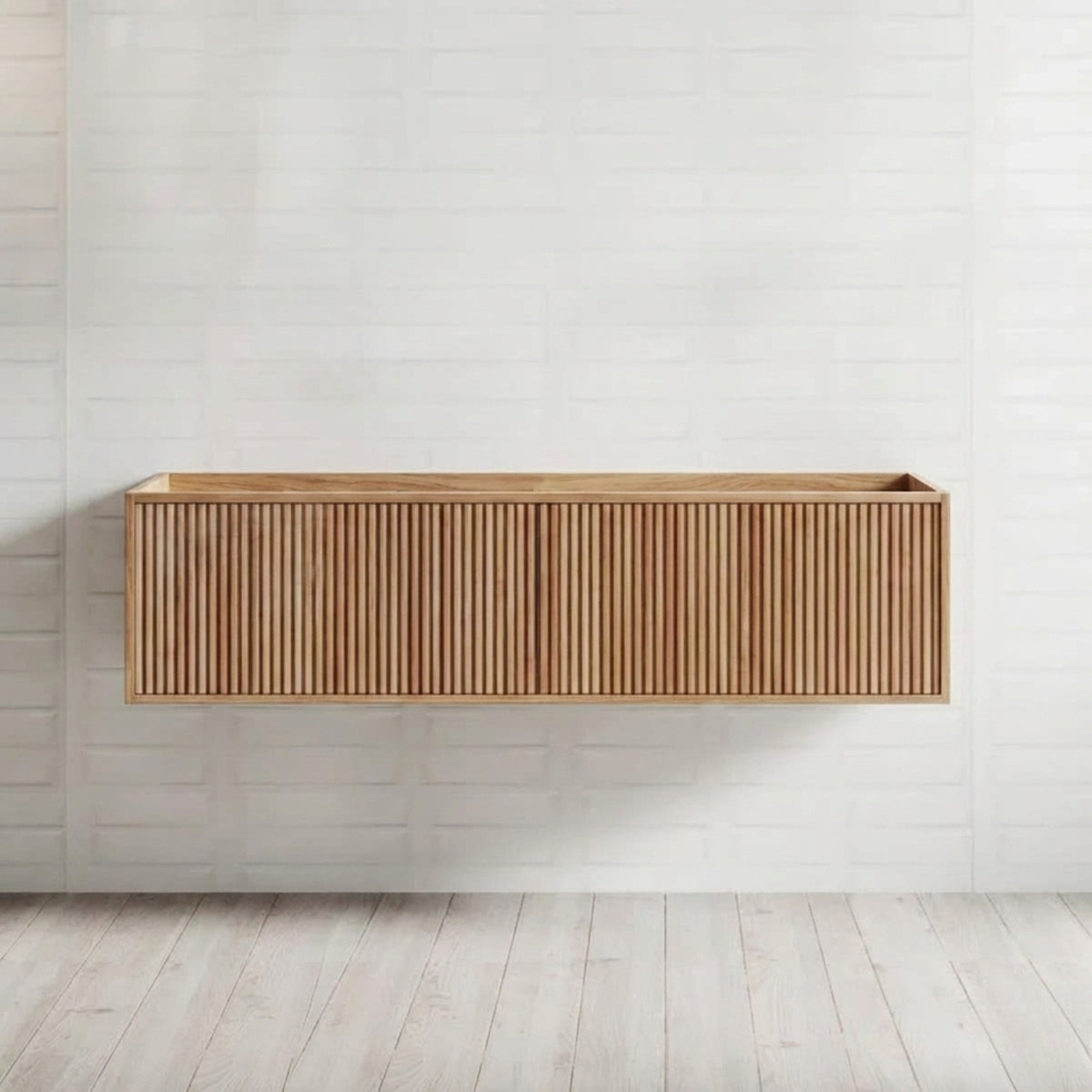 Ingrain Grooved wall hung vanity in warm ash woodgrain, with fluted drawer front, shown floating against white tiled wall.