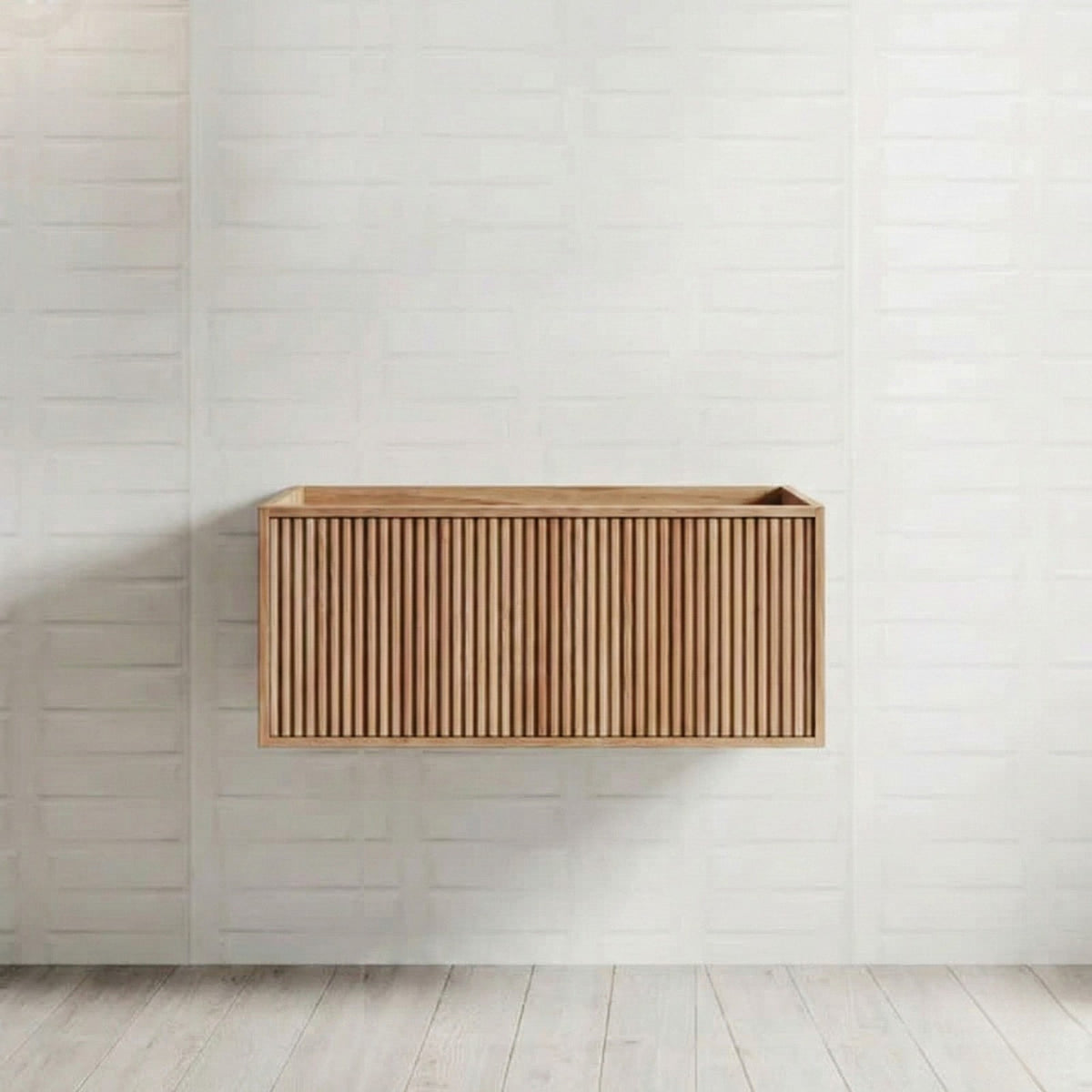 Ingrain Grooved wall hung vanity in ash woodgrain, shown front on against a white tiled bathroom wall
