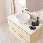 Marquis Marq wall hung vanity with white top, round basin and light woodgrain drawers in bathroom setting