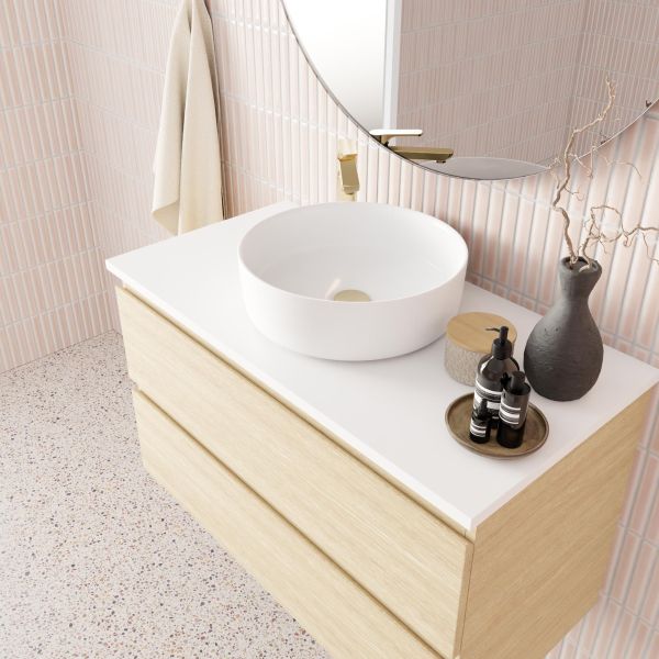 Marquis Marq wall hung vanity with white top, round basin and light woodgrain drawers in bathroom setting