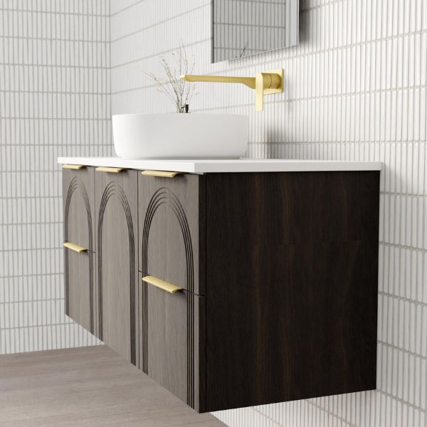Marquis Arco wall hung vanity in dark woodgrain with white top, arched fronts and brushed brass handles in bathroom setting