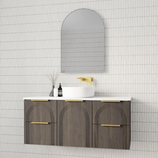 Marquis Arco wall hung vanity in Prime Oak finish with brushed brass handles, white top and round basin under arched mirror