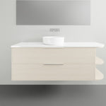 Marquis Avion wall hung vanity with white top, centre basin, light wood finish and curved open shelves on the right