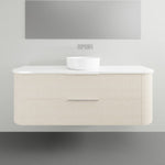 Marquis Shore wall hung vanity with white solid surface top, round basin and fluted light woodgrain drawers