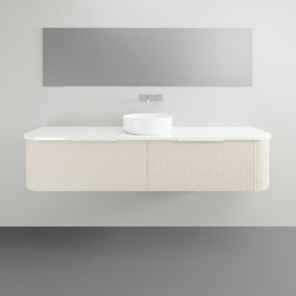 Marquis Shore wall hung vanity with fluted curved cabinet, white solid surface top and basin, front view