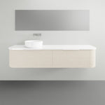 Marquis Shore wall hung vanity with white solid surface top, fluted curved cabinet and basin, front view