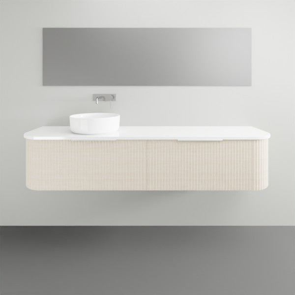 Marquis Shore wall hung vanity with white solid surface top, fluted curved cabinet and basin, front view