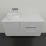 Marquis wall hung vanity with white solid surface top, above counter basin and drawers in a minimalist bathroom setting