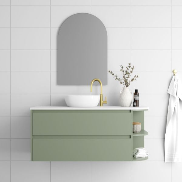 Marquis Avion wall hung vanity in sage green with white basin and top, right shelf, round mirror, brass tapware