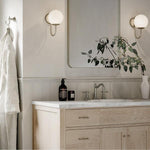 Phoenix Nostalgia lever basin set in brushed nickel on a bathroom vanity with shepherds crook spout and lever handles