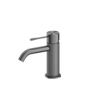 Nero Opal basin mixer tap in graphite finish, with textured cylindrical body and curved spout on white background
