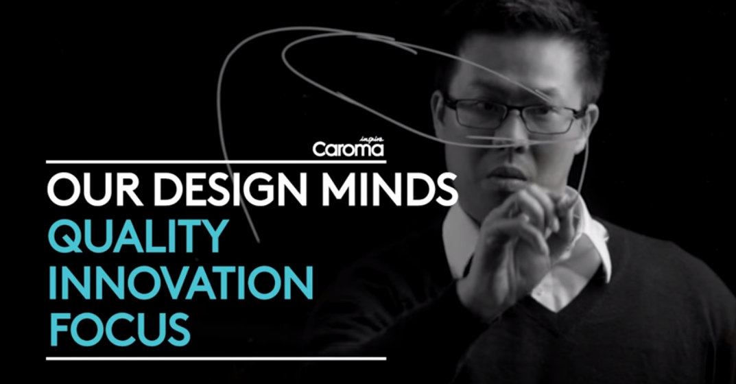 Caroma branding graphic with a man drawing, showing “Our Design Minds” and the words Quality, Innovation, Focus on black background