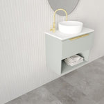 Marquis Oxford wall hung ensuite vanity in pale grey with white top, open shelf and brushed brass handle, shown with basin