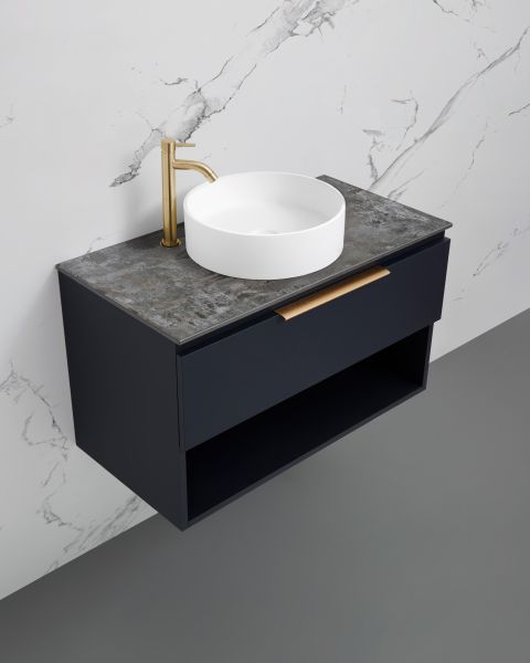 Marquis Oxford wall hung vanity in dark navy with stone-look top, open shelf and round white basin, angled view