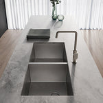 Phoenix 4000 Series brushed stainless steel double bowl kitchen sink in a concrete benchtop, undermount view with mixer tap