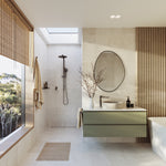 Phoenix Kusabi basin mixer in brushed carbon on a vanity in a modern beige bathroom setting