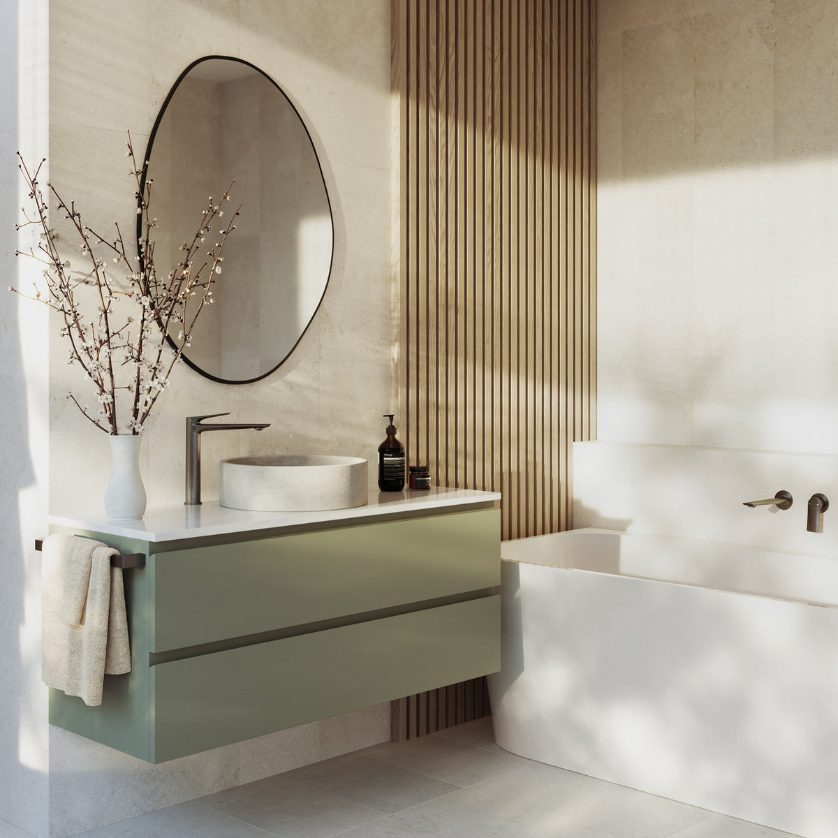 Phoenix Kusabi brushed carbon basin mixer on a vanity beside a round basin in a modern bathroom setting