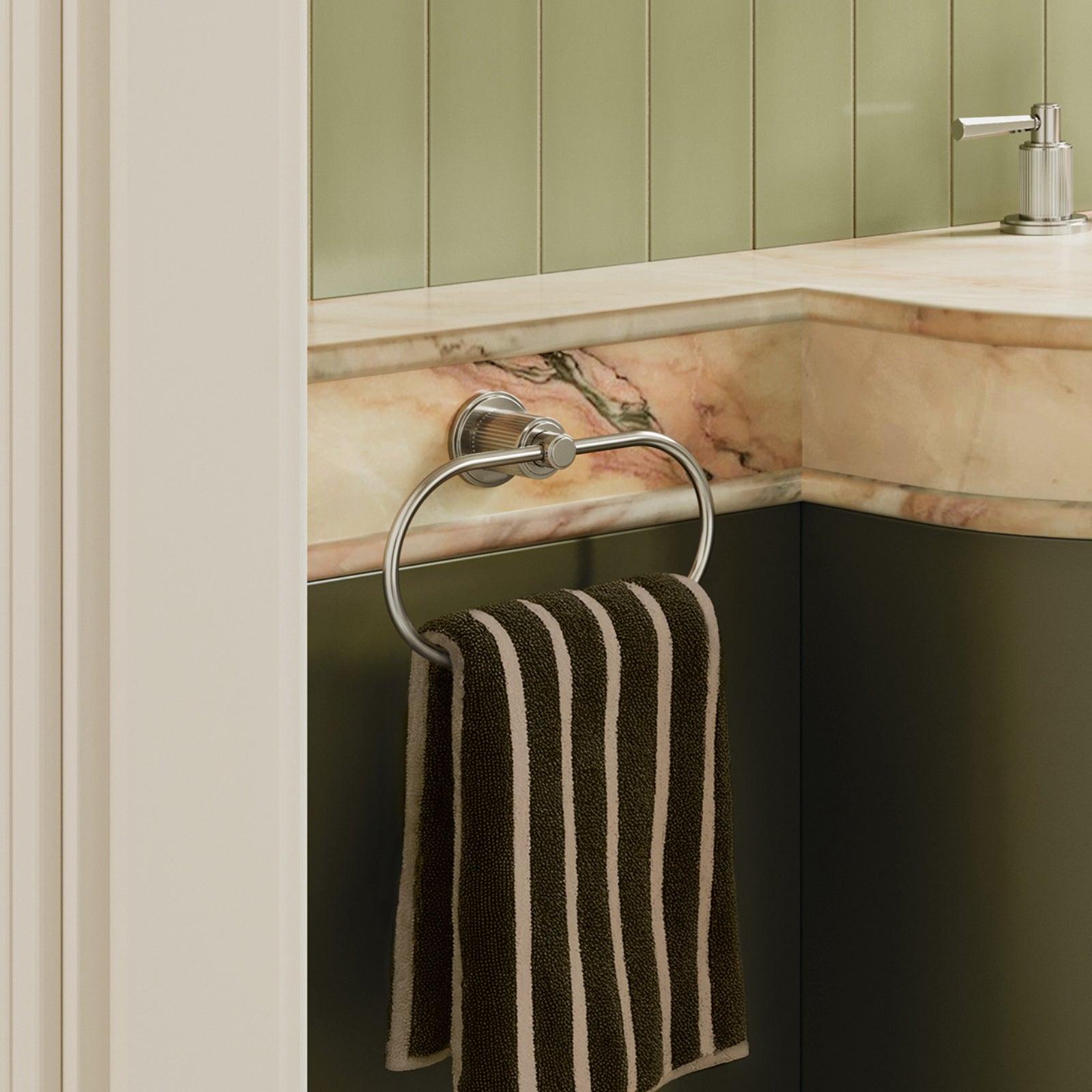 Phoenix Wiltern brushed nickel hand towel holder with ring, mounted on a bathroom vanity wall holding a striped towel