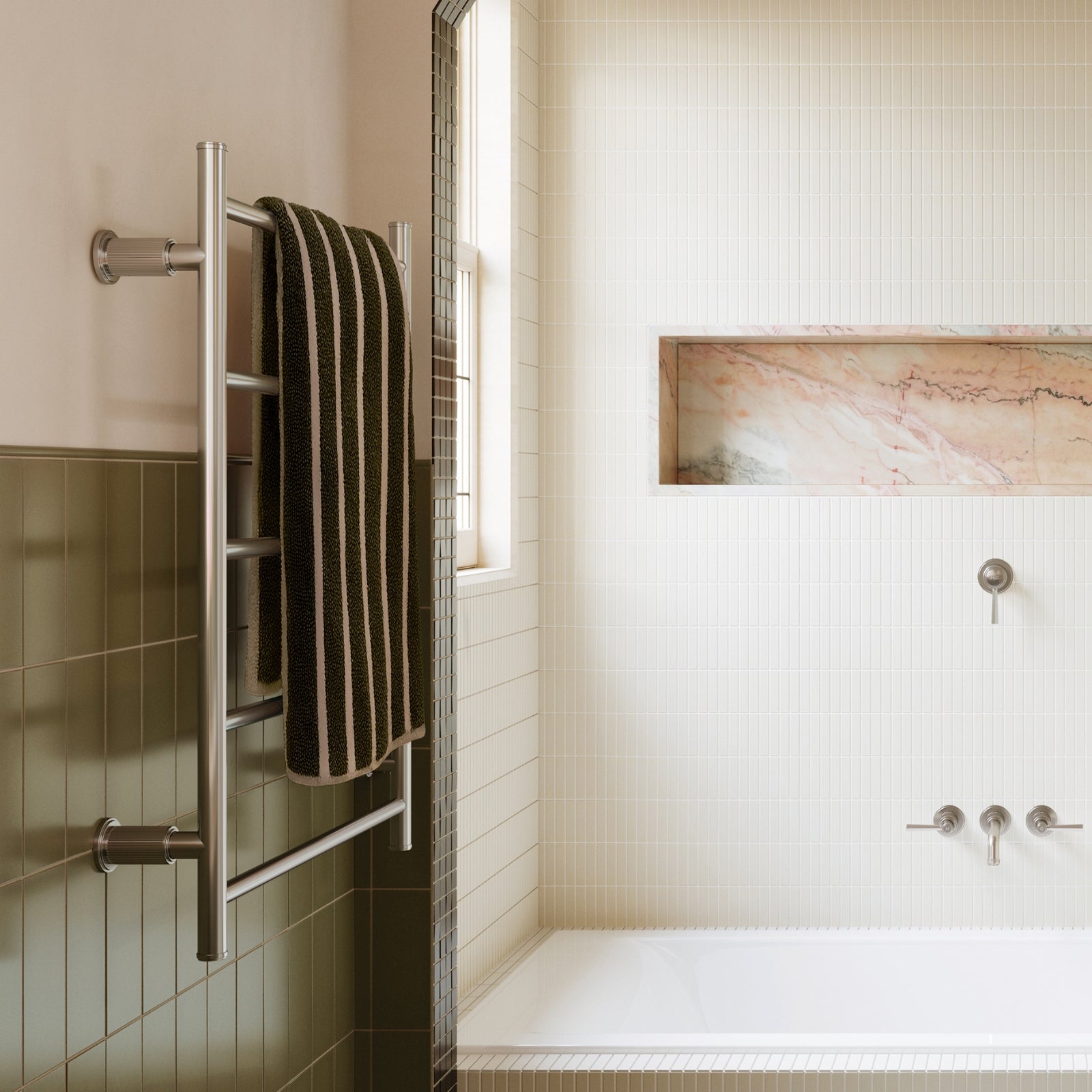 Phoenix Wiltern heated towel ladder in brushed nickel, styled in a modern bathroom with towel draped over the rail