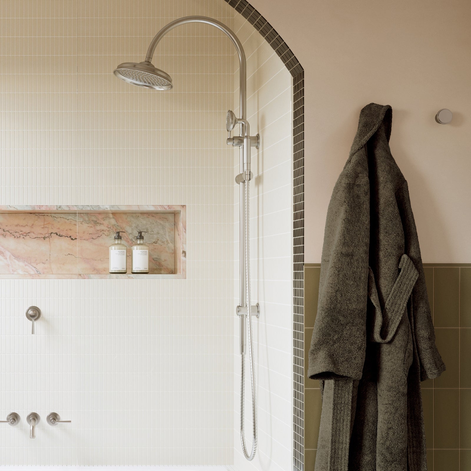 Phoenix Wiltern twin shower in brushed nickel, shown in a tiled bathroom with overhead and hand shower rail view