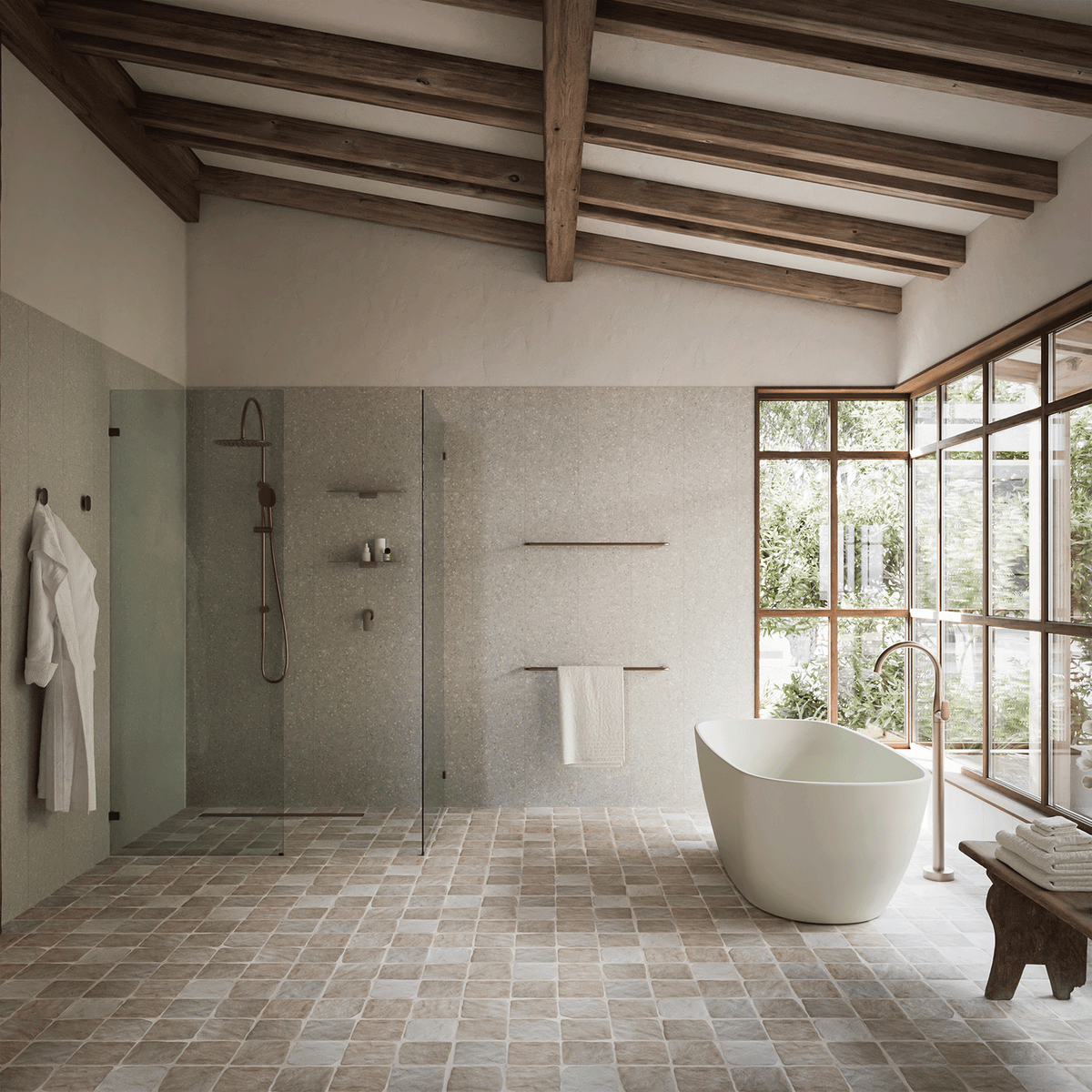 Caroma Contura II brushed bronze bath and shower mixer in a modern bathroom with freestanding bath and walk-in shower