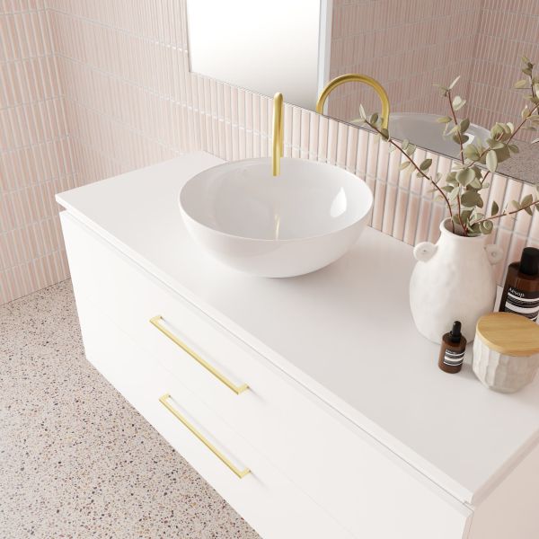 Marquis Riviera wall hung vanity in white matte finish with gold handles and round above-counter basin, bathroom setting