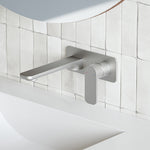 Caroma Luna wall basin/bath mixer in brushed nickel, wall-mounted over a white tiled basin area