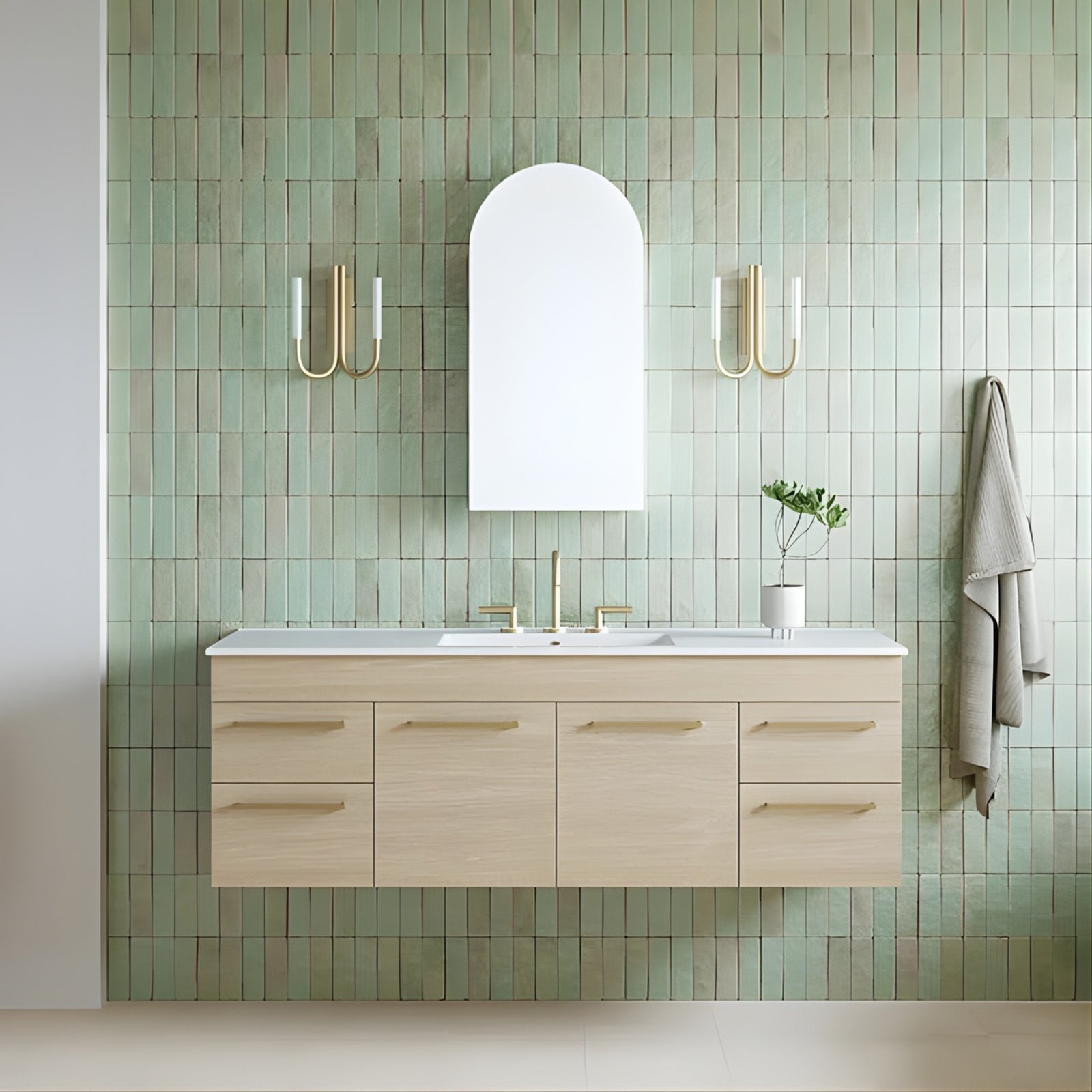 Timberline Indiana wall hung vanity with white ceramic top, light woodgrain finish and gold handles in bathroom setting