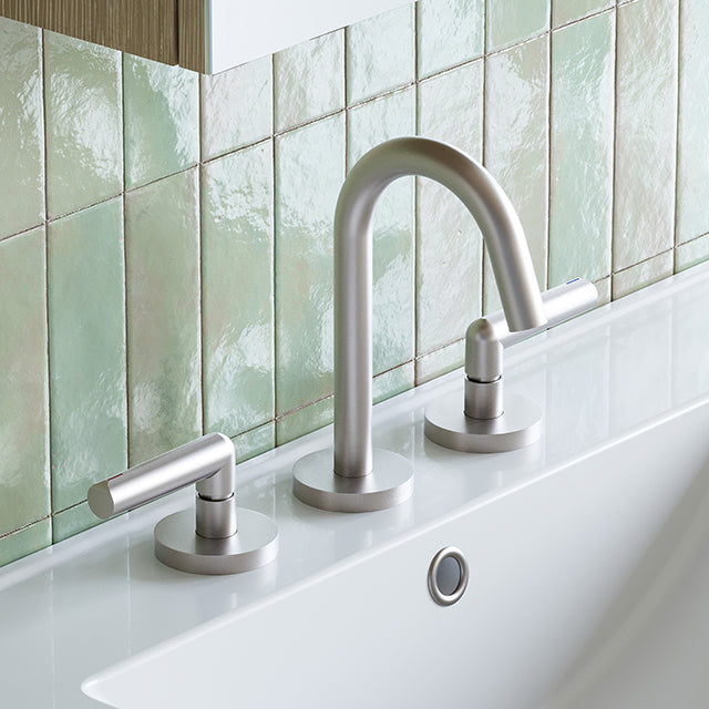 Phoenix Vivid Slimline Plus brushed nickel 3 piece basin set with lever handles on a white basin