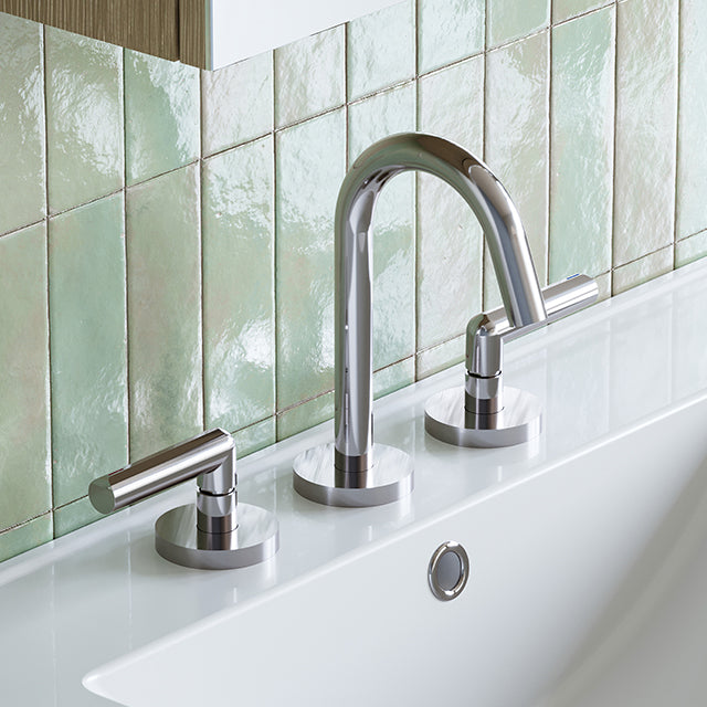 Phoenix Vivid Slimline Plus chrome 3 piece basin set with arched spout and lever handles on a white basin