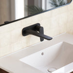 Caroma Contura II matte black wall basin/bath mixer with lever handle, shown installed over a white basin on tiled wall
