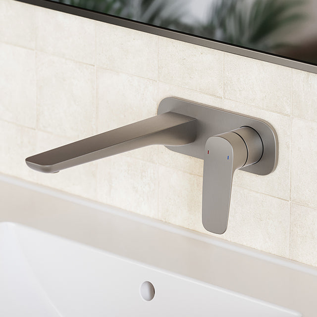 Caroma Contura II wall basin/bath mixer in brushed nickel, wall-mounted over a tiled bath surround, side view