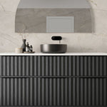 Marquis Salamander wall hung vanity in black, with ribbed drawers, white benchtop and round vessel basin in bathroom setting