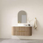 Marquis Shore wall hung vanity with fluted wood finish, white solid surface top and round basin, lifestyle view
