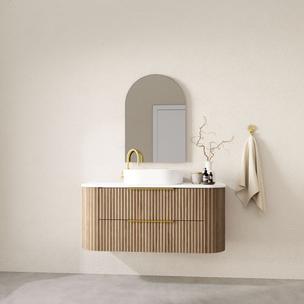 Marquis Shore wall hung vanity with fluted wood finish, white solid surface top and round basin, lifestyle view
