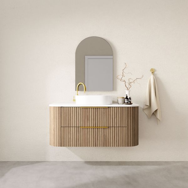 Marquis Shore wall hung vanity with fluted woodgrain drawers, white top and basin, brass handle, lifestyle view